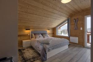 Posteľ alebo postele v izbe v ubytovaní Chalet La Trinité-Spa,Sauna,Pétanque-Gérardmer