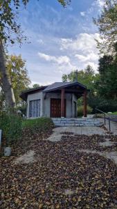 a small white house with a door in a yard at Stella Maris in Stella-Plage +7 photos