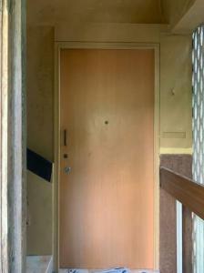a large door in a room with a wall at Secluded & green 2BHK in ancestral bunglow SCruz E in Mumbai