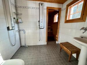a bathroom with a shower and a sink at Villa Kukka , LaatuLomat in Juva +21 photos