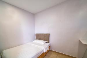 Postel nebo postele na pokoji v ubytování Hotel Uptown Semenyih