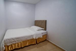 Postel nebo postele na pokoji v ubytování Hotel Uptown Semenyih