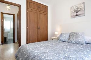 Łóżko lub łóżka w pokoju w obiekcie Apartamento Atlántico
