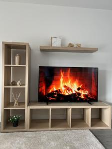 a fireplace in a living room with a fire place at 2 Bedroom City Centre Apartment in Hemel Hempstead in Hemel Hempstead
