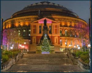 a building with a christmas tree in front of it at Palm Studio in London