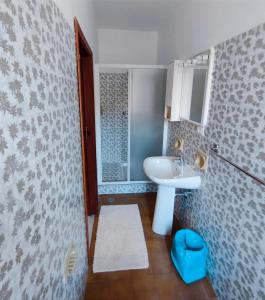 a bathroom with a sink and a shower at Hotel Da Bruno in Rocchetta Ligure