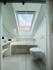 a bathroom with a toilet and a bath tub at House called Happiness in Jelsa