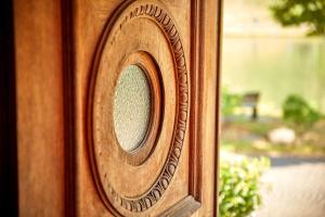 a wooden door with a clock on it at NEU!!! Moselbleibe Uferallee in Bernkastel-Kues