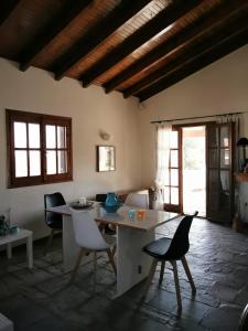 a dining room with a table and chairs in a room at Villa Christina in Karfas