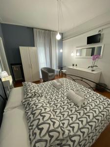 Postel nebo postele na pokoji v ubytování Delle Rose Rooms