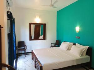Postel nebo postele na pokoji v ubytování Ayubowan Homestay Katunayake