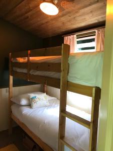 a couple of bunk beds in a room at The Vobster Inn in Radstock