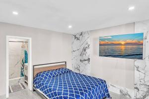 a white bedroom with a bed and a painting on the wall at Modern Villa with Pool Hollywood Hard Rock Casino in Fort Lauderdale +79 photos