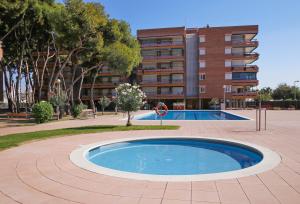 Bazén v ubytovaní AT080 Pins, comunidad con piscina en 1ra línea de la playa alebo v jeho blízkosti