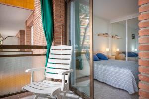 Posteľ alebo postele v izbe v ubytovaní AT080 Pins, comunidad con piscina en 1ra línea de la playa + 27 fotografií