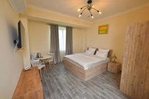 Ένα ή περισσότερα κρεβάτια σε δωμάτιο στο Altunyan Hotel