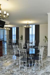 a dining room with a table and chairs at Altunyan Hotel in Yerevan