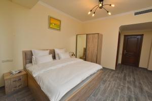 Ένα ή περισσότερα κρεβάτια σε δωμάτιο στο Altunyan Hotel