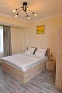Ένα ή περισσότερα κρεβάτια σε δωμάτιο στο Altunyan Hotel