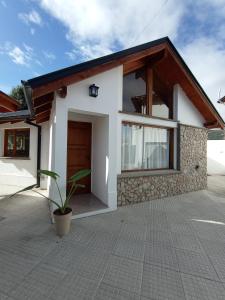 a small house with a lot of windows at La Casita in Esquel