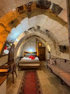 A bed or beds in a room at Zuwinasa House Hotel