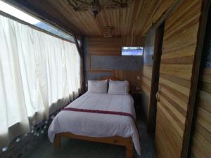 Voodi või voodid majutusasutuse Mamallacta Páramo Lodge toas