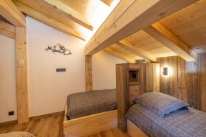 Postelja oz. postelje v sobi nastanitve Chalet Quartz