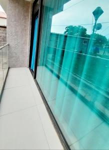 a window with a view of a street at Dream House Ureki in Ureki
