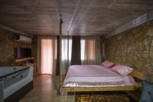 Postel nebo postele na pokoji v ubytování Onore dell amore 2 apartman sa djakuzijem