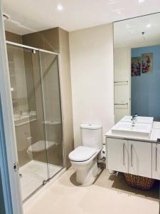 a bathroom with a toilet and a shower and a sink at Two bedrooms apartment in the heart of Melb CBD in Melbourne