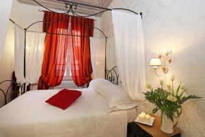 Postel nebo postele na pokoji v ubytování Daplace - HQH Colosseo