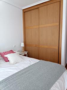 Postel nebo postele na pokoji v ubytování Apartamento con terraza