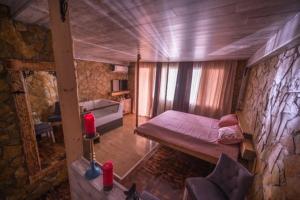 Postel nebo postele na pokoji v ubytování Onore dell amore 2 apartman sa djakuzijem