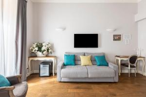 Televízia a/alebo spoločenská miestnosť v ubytovaní Spagna Art & Suites - CA Domus Collection