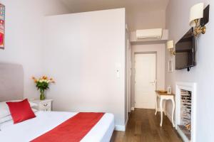 Posteľ alebo postele v izbe v ubytovaní Spagna Art & Suites - CA Domus Collection