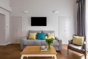 Televízia a/alebo spoločenská miestnosť v ubytovaní Spagna Art & Suites - CA Domus Collection