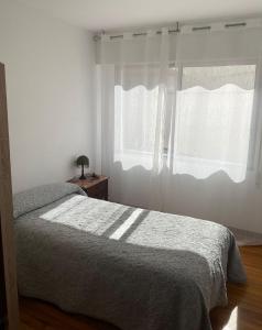 Posteľ alebo postele v izbe v ubytovaní Apartamento céntrico con vistas y cerca de playa