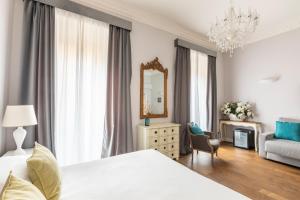Posteľ alebo postele v izbe v ubytovaní Spagna Art & Suites - CA Domus Collection