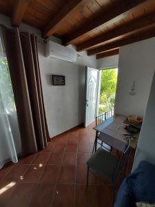 a dining room with a table and a window at Green Oasis 2 in Lámira