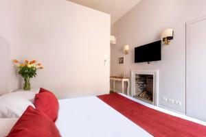 Posteľ alebo postele v izbe v ubytovaní Spagna Art & Suites - CA Domus Collection