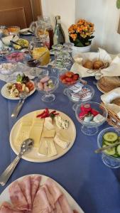 a table with many plates of food on it at Zur Querensteder Mühle in Bad Zwischenahn
