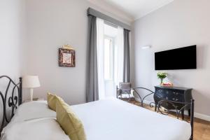 Posteľ alebo postele v izbe v ubytovaní Spagna Art & Suites - CA Domus Collection