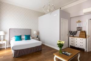 Posteľ alebo postele v izbe v ubytovaní Spagna Art & Suites - CA Domus Collection