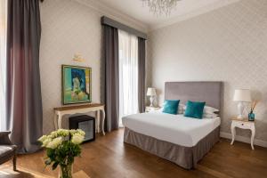 Posteľ alebo postele v izbe v ubytovaní Spagna Art & Suites - CA Domus Collection