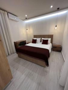 Säng eller sängar i ett rum på CARA Creta Home