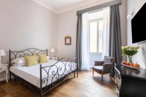 Posteľ alebo postele v izbe v ubytovaní Spagna Art & Suites - CA Domus Collection