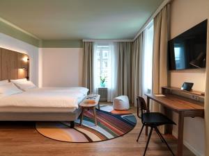 Un pat sau paturi într-o cameră la Hotel St. Josef