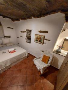 a room with two beds and a chair in it at Green Oasis 3 in Lámira