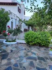 a house with a stone walkway in front of a building at Green Oasis 3 in Lámira +20 photos