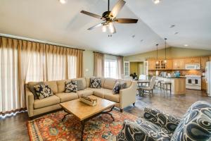 a living room with a couch and a table at Stunning Lake Hamilton Getaway with Hot Tub! in Hot Springs
